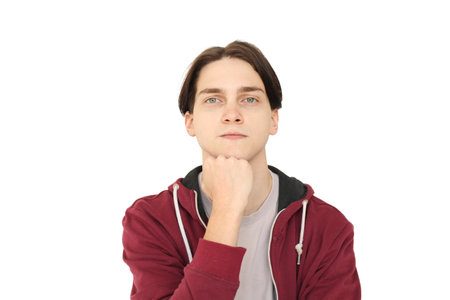 Portrait of clever serious pensive young adult man thinking isolated on white background