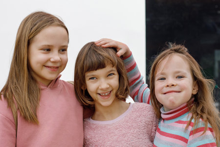 Cheerful kids hugging outdoor, portraitの写真素材