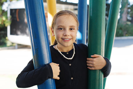 Beautiful young girl looking at camera outdoor portrait