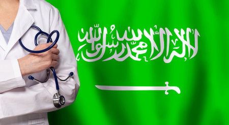 Saudi Arabian medicine and healthcare concept. Doctor close up against flag of Saudi Arabia backgroundの写真素材