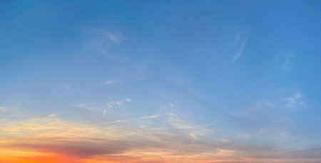 Blue sunrise sky with gold and red sunlight. Skym sun and cloud, outdoors weather backgroundの写真素材