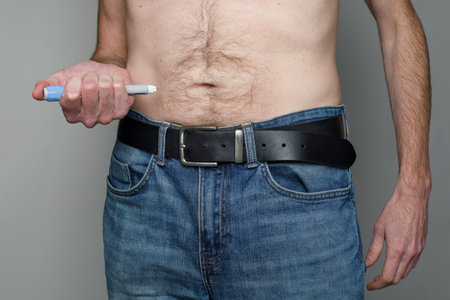 Man injecting Semaglutide Ozempic injection control blood sugar levels close upの写真素材