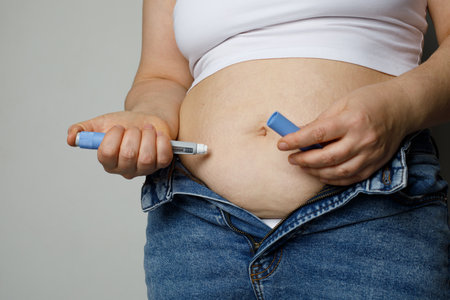 Woman injecting Semaglutide Ozempic injection control blood sugar levelsの写真素材