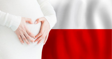 Demographics, pregnancy and love baby in Poland concept. Pregnant woman making heart against her stomach on Polish flag background.の写真素材