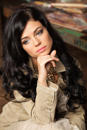 Cute fashion model woman with healthy long hairstyle and trendy make-up. Beautiful female face close-upの写真素材