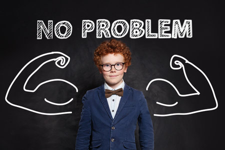 Adorable happy child boy portrait on black backgroundの写真素材