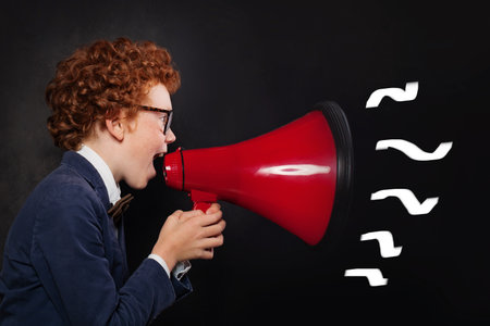 Child screaming red megaphone on black background