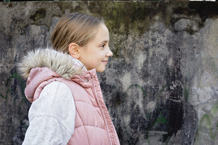 Positive child smiling, outdoors portrait. Happiness and childhood concept