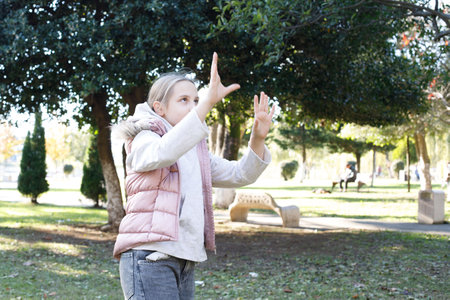 Active playing child girl outdoors portraitの写真素材