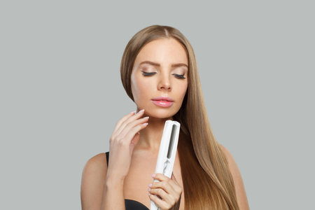 Woman with long brown hair, natural makeup and healthy clean skinの写真素材