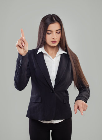 Brunette woman in black suit and white shirtの写真素材