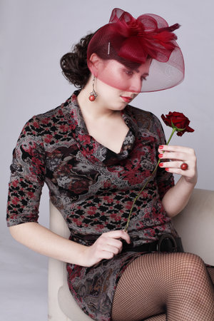 Pretty brunette woman in red hat retro style fashion beauty portraitの写真素材