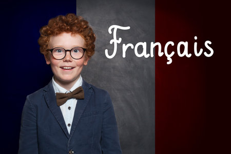 School child boy on French flag with the inscription Francais in French. Education and study language in France conceptの写真素材