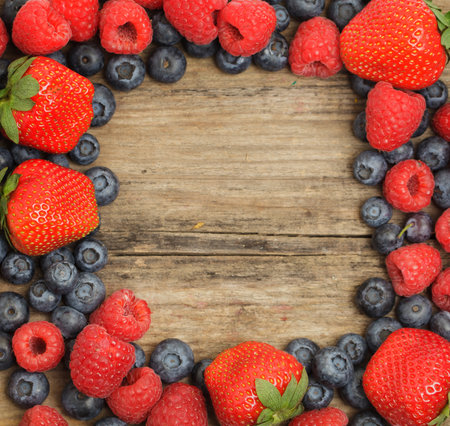 Fruit food frame background. Strawberry, raspberry and blueberryの写真素材