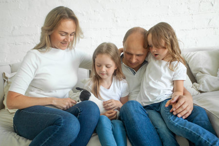 Cheerful family mother, father and children with little dogの写真素材