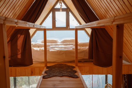 wooden country house with a large window and a beautiful viewの写真素材