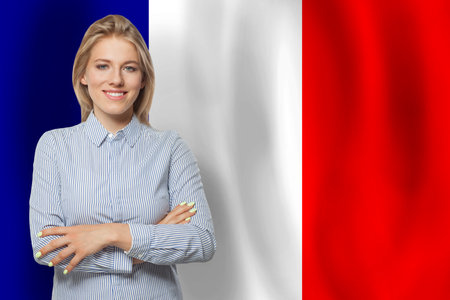 Successful happy woman with flag of Franceの写真素材