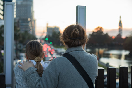 Loving family. Playful child girl and happy mother, outdoors portraitの写真素材