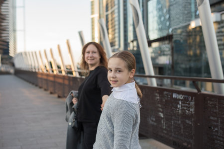 Portrait of mother and daughter outdoors together. Family lifestyle portraitの写真素材