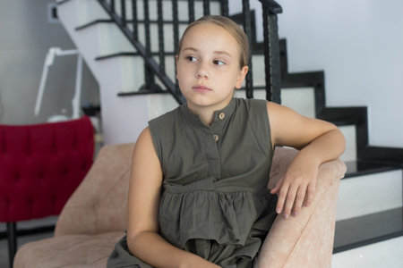 Kid child girl sitting at home, indoor portrait