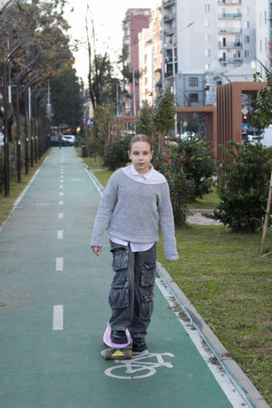 Kid girl on pink skateboard. Skateboard Skillsの写真素材