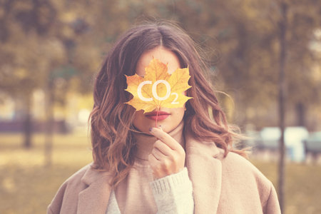 Leaves and trees protect women from carbon dioxide and global warming outdoors