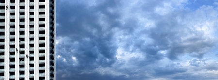 Industrial man worker from cleaning service on the facade of a skyscraperの写真素材
