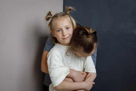 Smiling children little girl and boy together at home. Sibling indoor, childhood conceptの写真素材