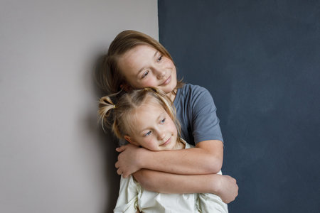 Happy children little girl and boy together at home. Sibling indoor, childhood concept