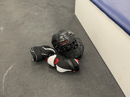 sportswear and skates for a hockey player in the team's locker roomの写真素材
