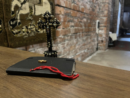 new testament with other church objects on the bench in church
