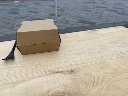 a lunch box on the left on the tableの写真素材