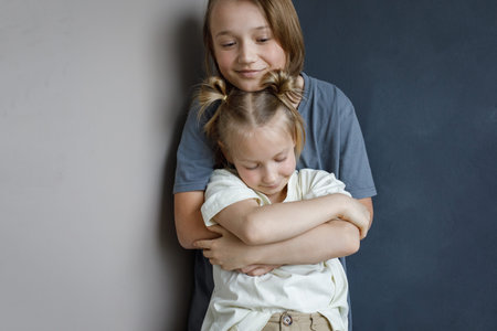 Adorable children little girl and boy together at home. Sibling indoor, childhood conceptの写真素材
