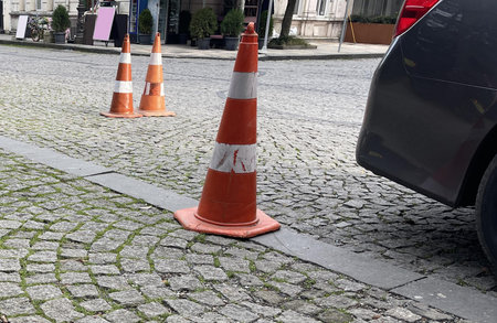 a cone on the sidewalk in the cityの写真素材