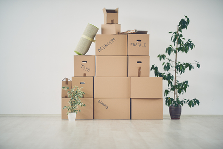 Piled up boxes in new apartmentの写真素材