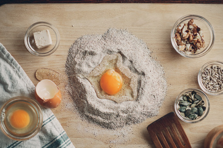 Close up of woman`s hands making a bread.の写真素材