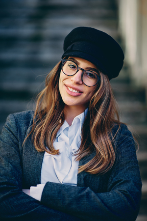 Head shot of beautiful brunette wearing glasses.の写真素材