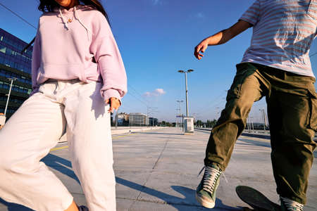 Two teenagers skate skateboard and run towards the camera.の写真素材