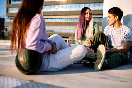 Teenager escaping the school and having fun in city.の写真素材