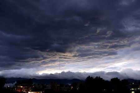 Night landscape, dense clouds, low, dark gray, being about to rain heavilyの写真素材