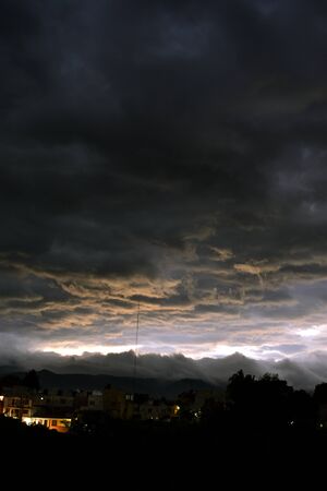 Night landscape, dense clouds, low, dark gray, being about to rain heavilyの写真素材