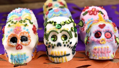 Handmade skulls, elaborated main sugar ingredient, decorated with colored icing sugar and sequins....