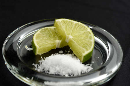 Lemon cut, salt and placed in a glass bowlの写真素材