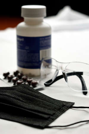 mask with protective glasses and medicine to fight respiratory diseasesの写真素材