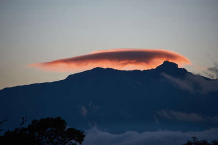 Perote chest in a sunset and an orange cloud by the reflection of the sunの写真素材