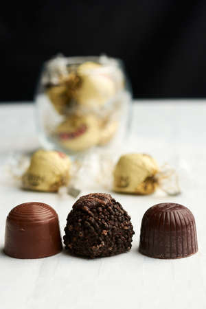 Chocolate of various textures, sweet background with its wrapperの写真素材