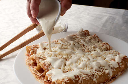 enchiladas, cheese, cream, hand, mexican tradition, veracruzana, gastronomy, mexico, live together, food, spicy, chileの写真素材