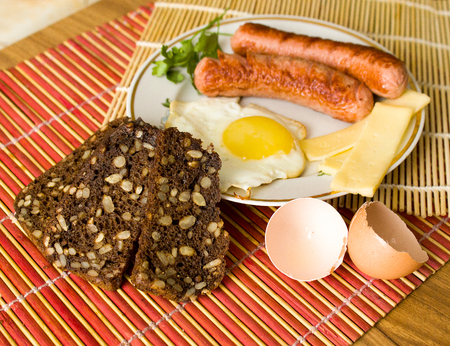 Very tasty rustic kitchen, fresh rural eggs with milk and breadの写真素材
