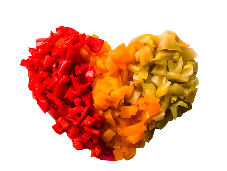 the vegetables which are laid out in the form of heart isolated on a white backgroundの写真素材