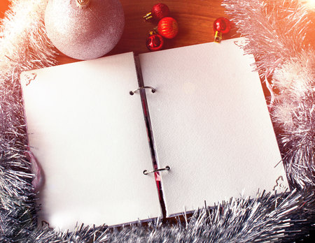 White notepad. Happy new year.New Year's goals with colorful decorations. Soft, gentle lighting effects.の写真素材